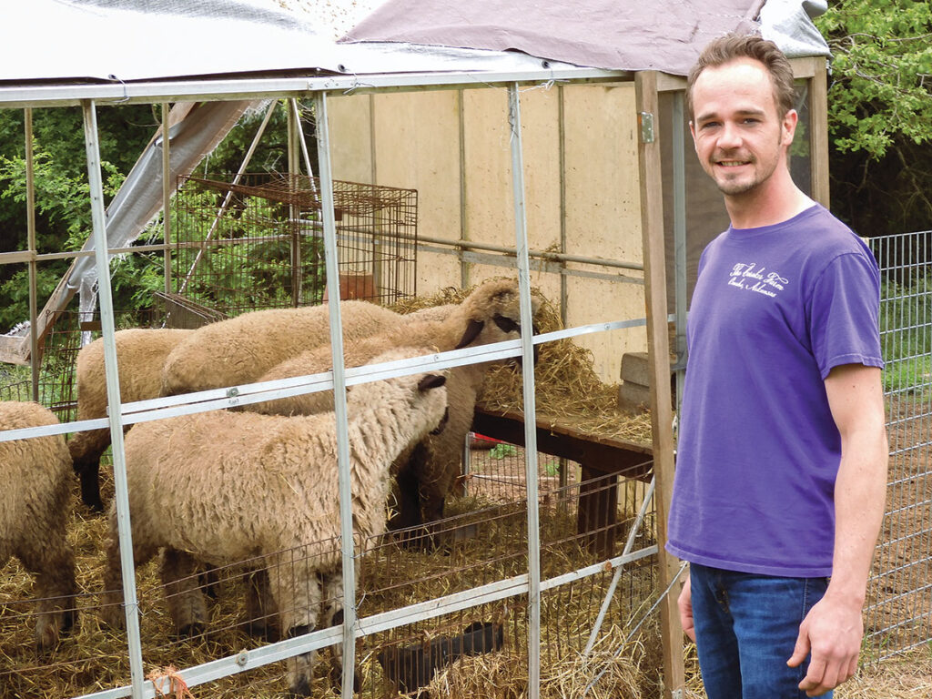 Brian Caraker with his sheep at his farm in Omaha, Arkansas. Photo by Terry Ropp.