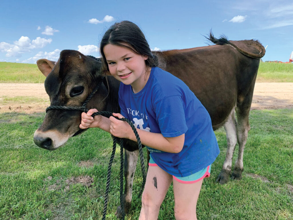 Harper VanZyverden with show heifer Honey Boo Boo.