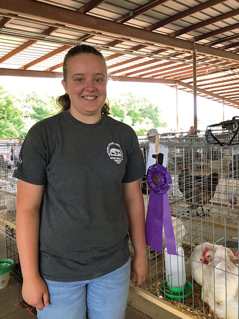 Sydni Wilson of Phillipsburg, Missouri with her chickens. Submitted Photo. 