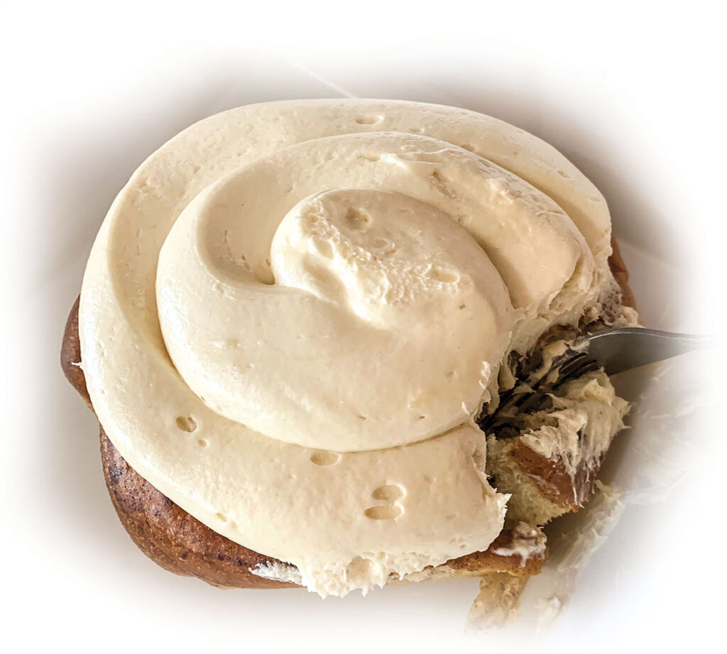 Plate-size cinnamon rolls with soft whipping cream like frosting available at Ozark Cafe in Jasper, Arkansas. Photo by Amanda Bradley.