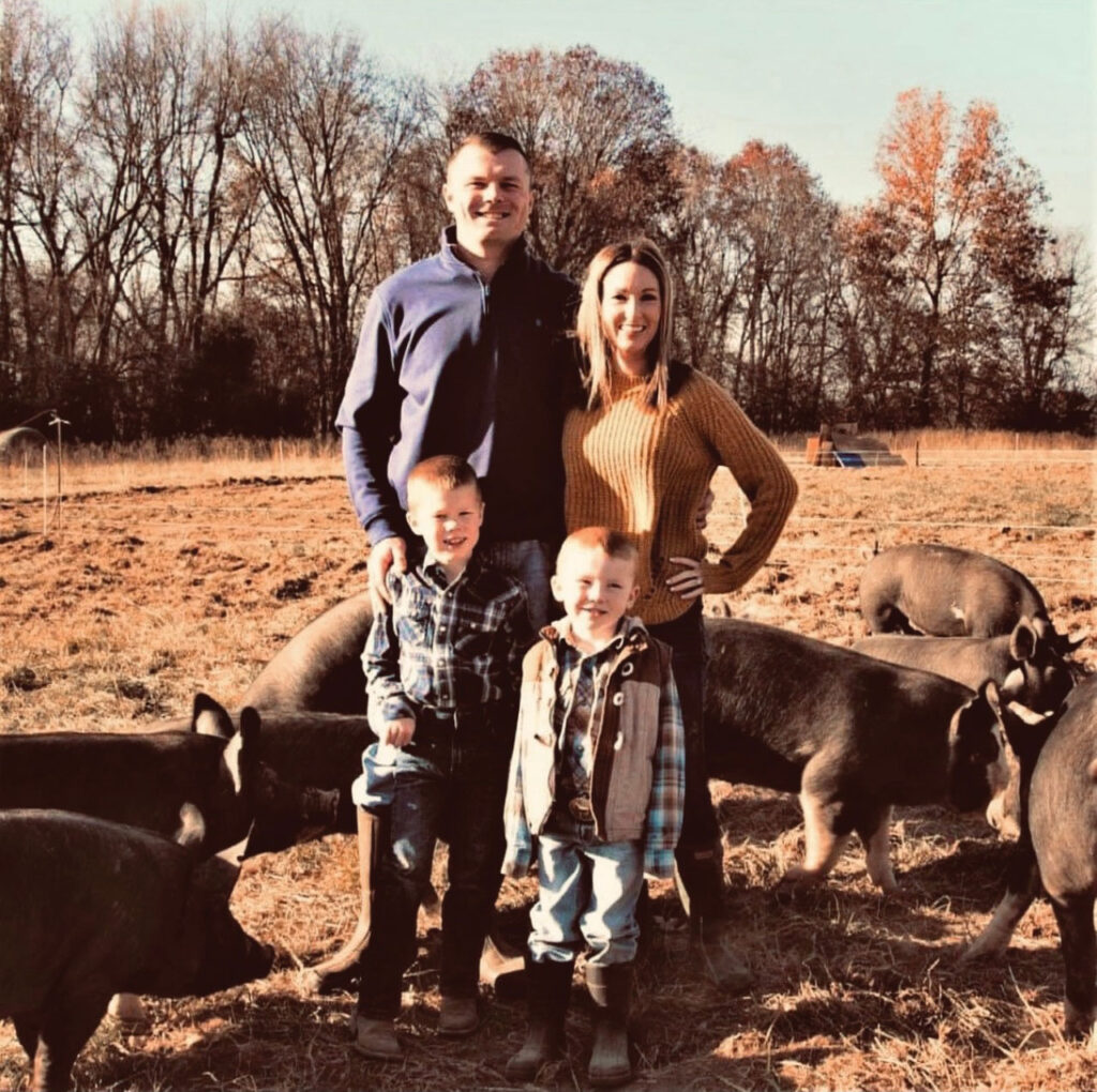 Jesse and Jessica Thurman, pictured with their children Luke and Cole, offer pasture-raised pork from Berkshire pigs. Submitted Photo.