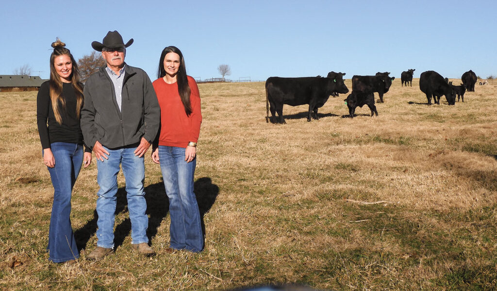 Sisters JoBeth Evans and Maggie Davidson of Hindsville, Ark. continue their family's farming tradition with Williams Angus Beef. Pictured with their father Jeff Williams. Photo by Terry Ropp.