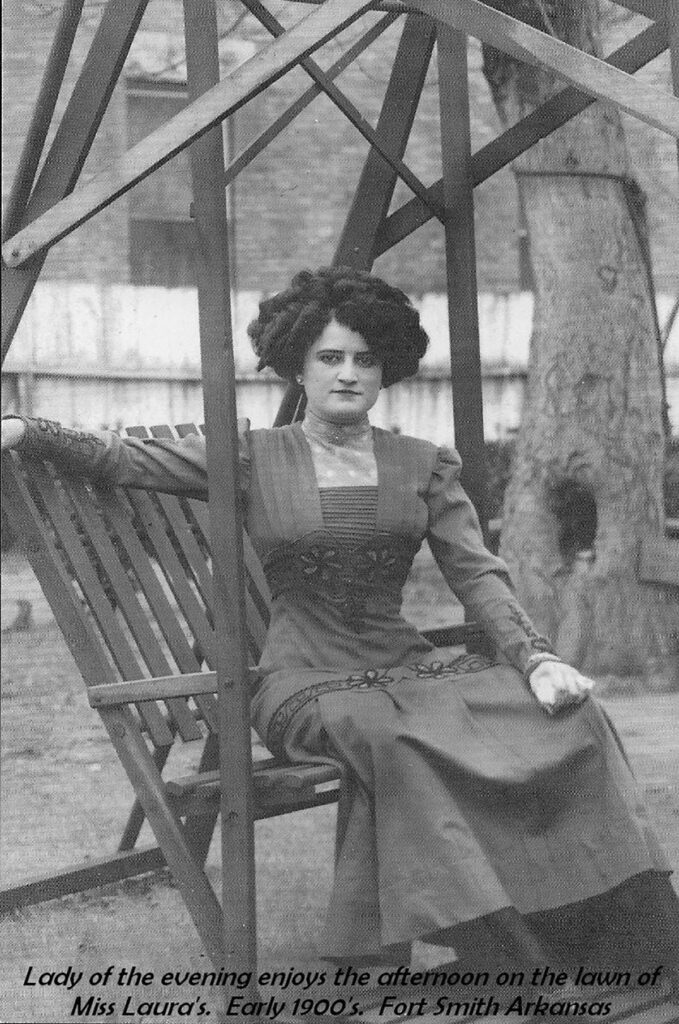 Lady of the evening enjoys the afternoon on the lawn of Miss Laura's. Early 1900's. Fort Smith, Arkansas. Submitted Photo. 