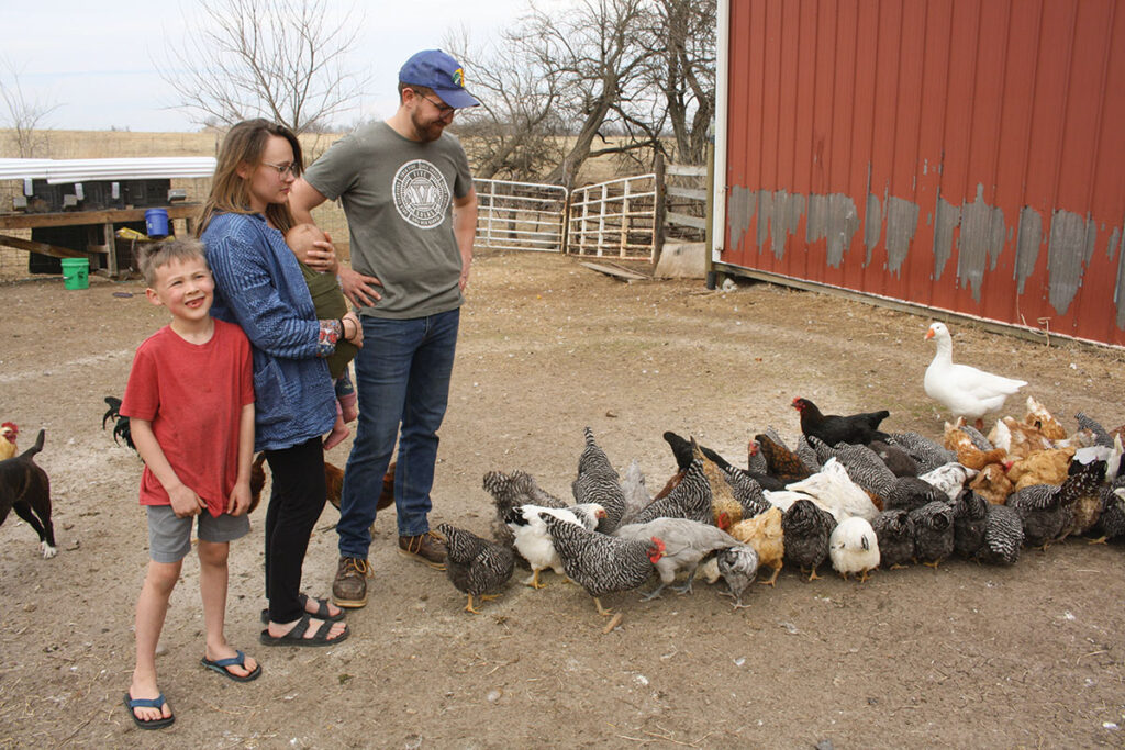 Ian and Ariel Gehris have a
pasture-based poultry operation at their farm near Fair Grove, Mo.,
Pictured with couple are their
children Thomas and Phoebe. Photo by Julie Turner-Crawford.