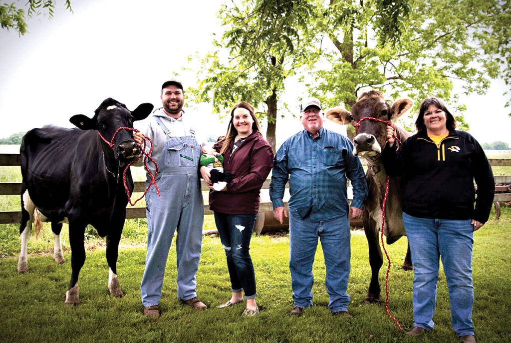 Miller Dairy is owned by John and Dawna Miller. Their son Trent and his wife Stephanie, holding 2-month-old Nolan are also active on the farm. Submitted Photo. 