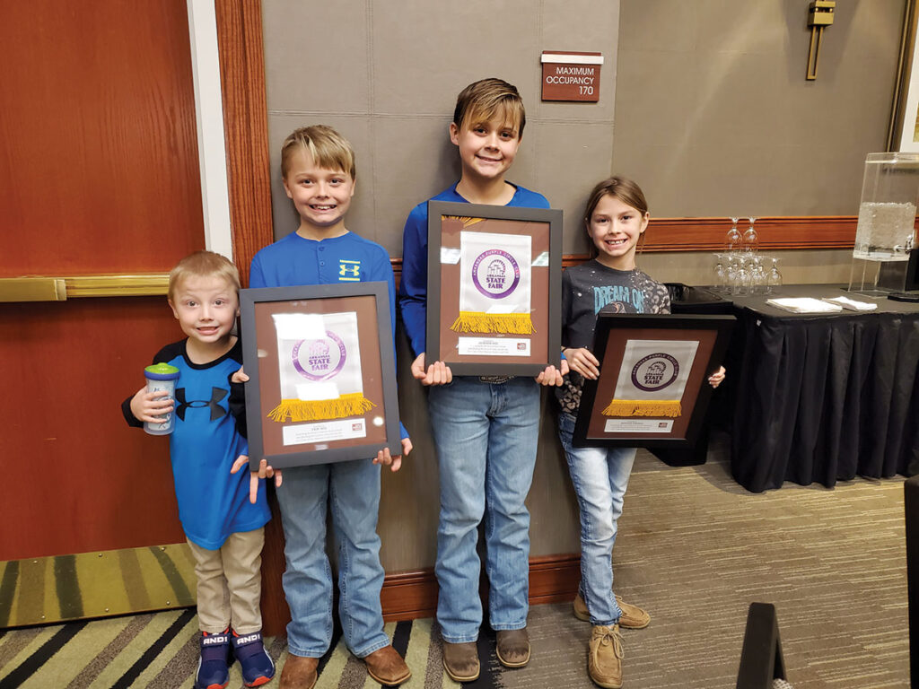 Thomas kids showing their awards. Submitted Photo. 