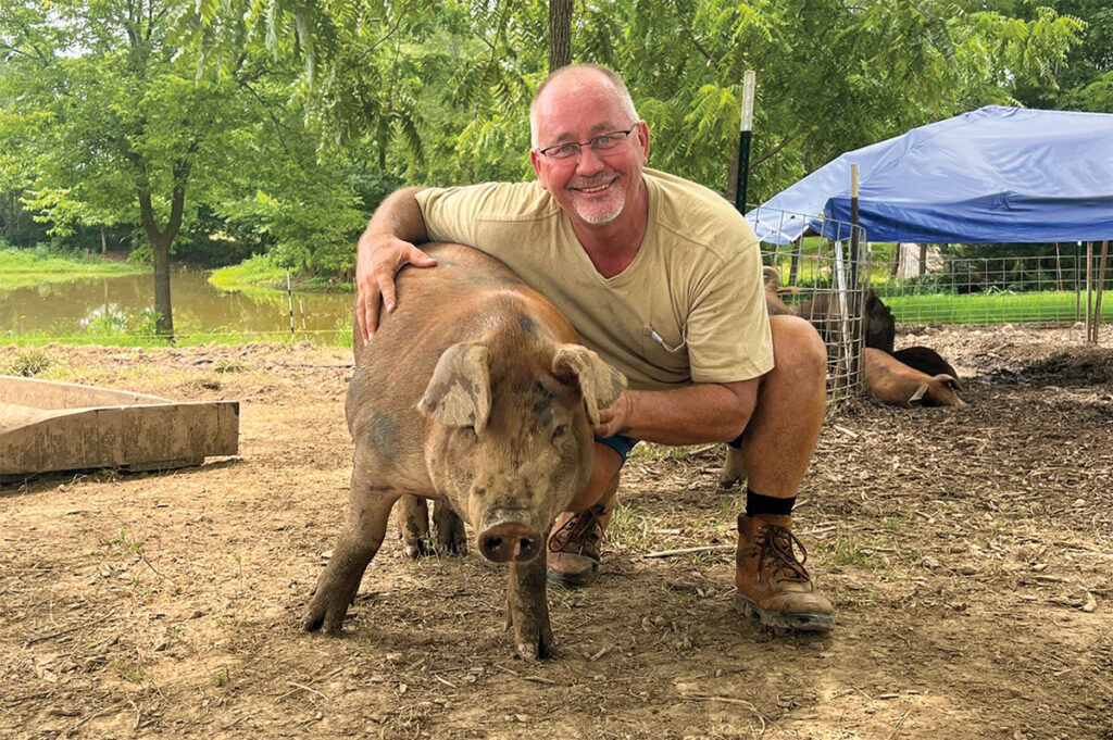 Chris Brust says his farm life 
has improved his mental health. Photo by Michael Kinney. 