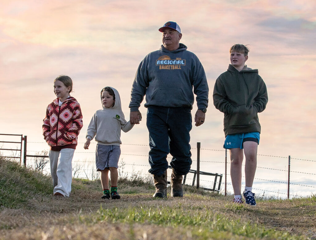 Bobby Howard checks cows with his favorite farm hands, his grandchildren Sloane Vericker, Riggins Howard and Knox Howard. Contributed Photo. 
