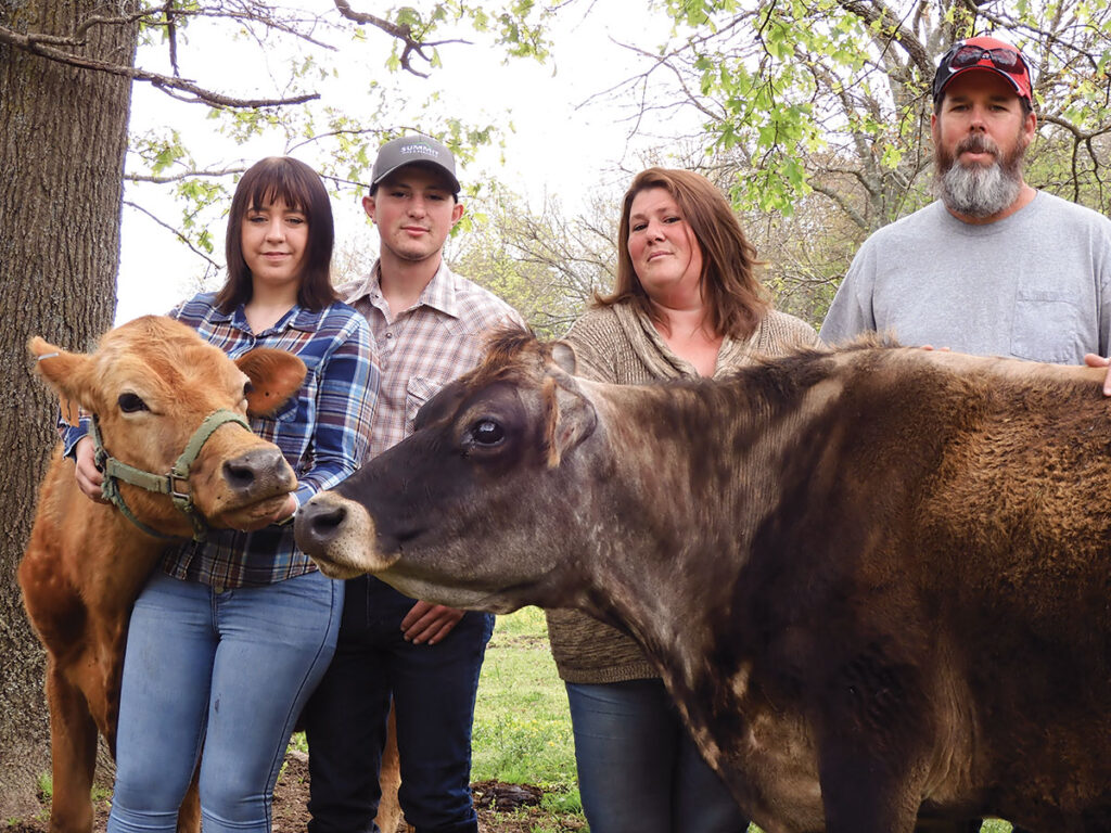 Howard family from Elkins, Ark., with their Jersey dairy cattle.