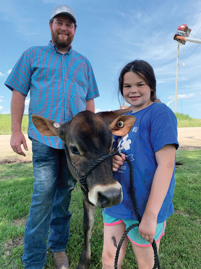 Scott VanZyverden and his daughter Harper are a part of the three-generation VanZyverden Dairy Farms operation near Ninagua, Mo.