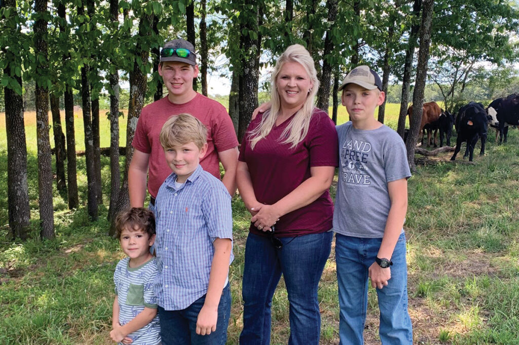 Kati Jones, pictured with her four sons Micheal, Isaac, Paul and Samuel, said raising livestock is just a way of life for her family.  Photo by Amanda Bradley.