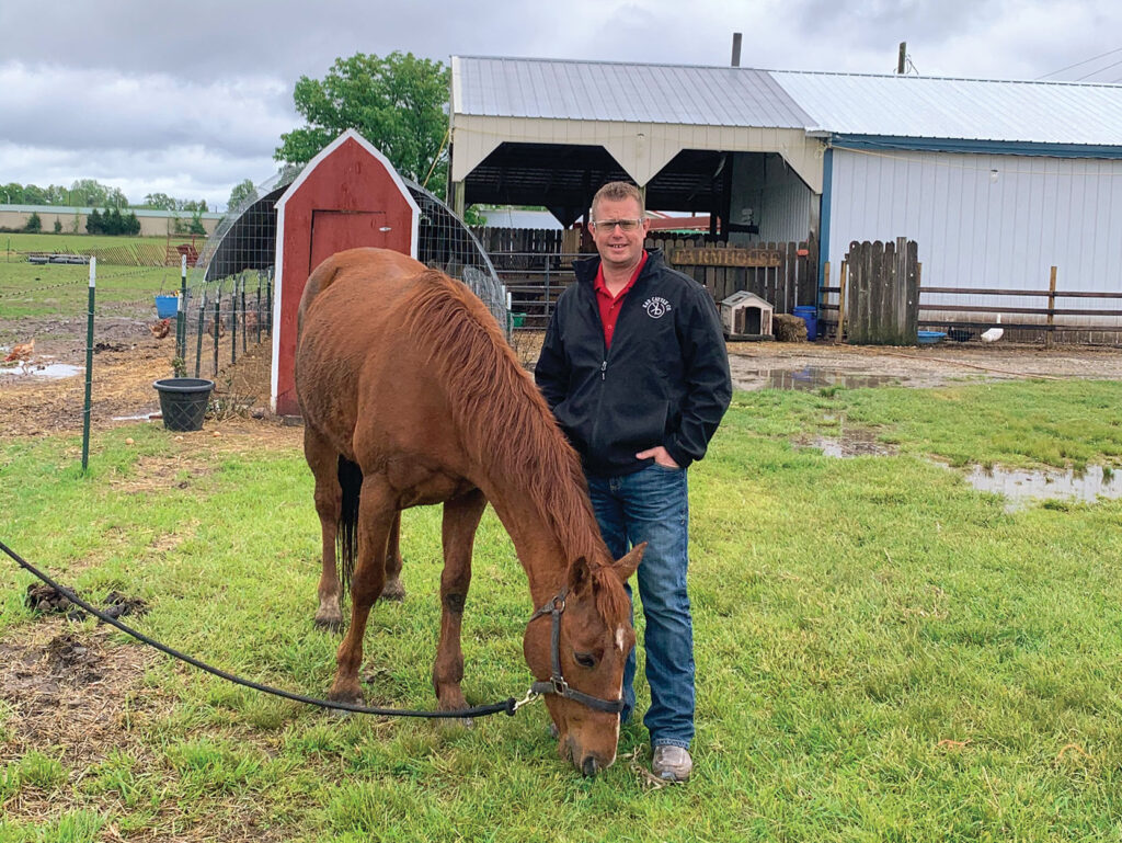 Dan Thornburg with his horse. This year K&D Cattle Company is excited to offer horse cart rides. Photo by Rachel Harper. 