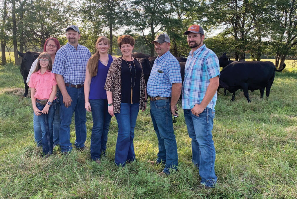 The Eagleburger family is working to improve the genetics of their registered herd through careful genetic selection. Pictured, from left, are Kassidie Eagleburger, Stacy Eagleburger, Jason Eagleburger, Brittany Wilkerson, Pam Eagleburger, Jeff Eagleburger and Nathan Eagleburger. Photo by Amanda Bradley.