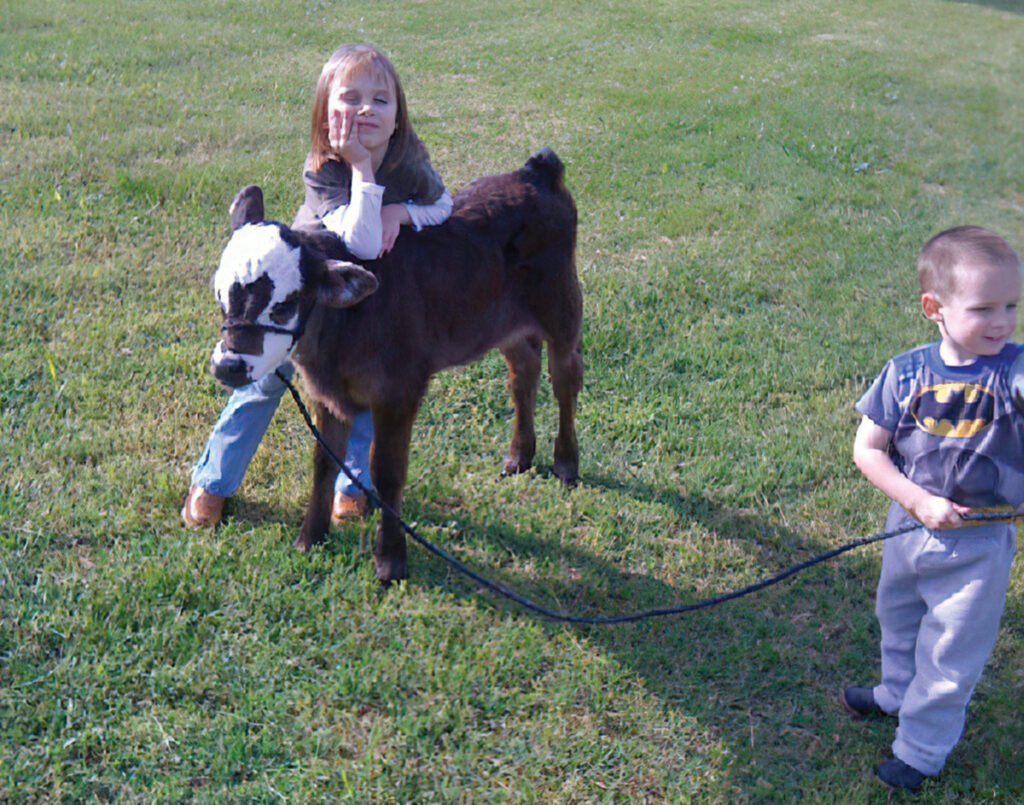 Kyla Moore, pictured her with her younger brother Keaton, was 5 years old when she got her first calf and began showing. Submitted Photo.