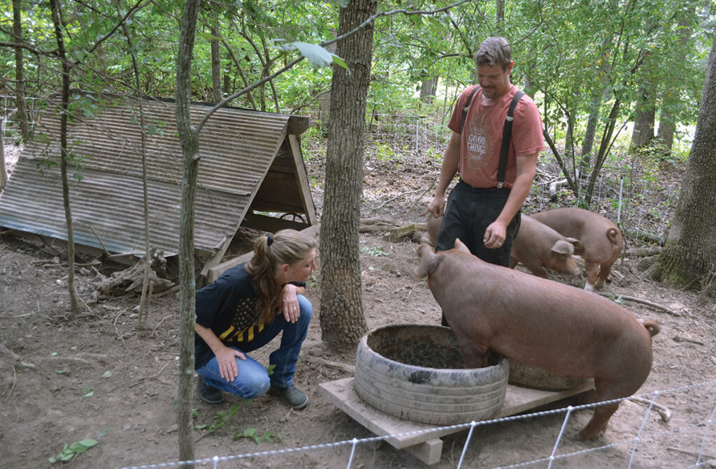 Jay and Dawn Remotti with their pigs. Photo by Laura L. Valenti.