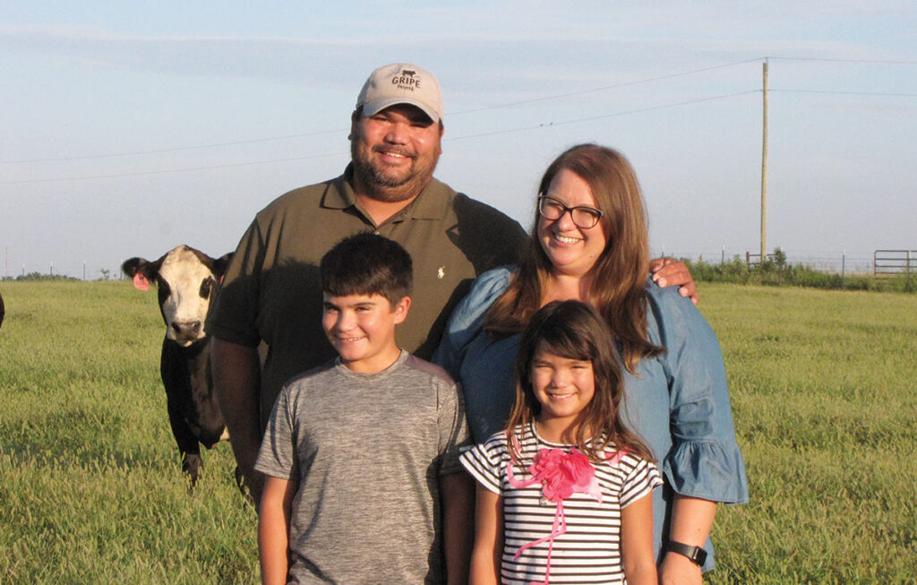 Brian and Sarah Gripe, pictured with their children Liam and Amelia, market beef under their own label. Photo by James McNary.