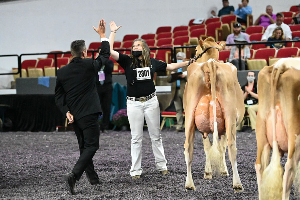 Whitney Yerina and her 3-year-old Guernsey Journey at the 2021 World Dairy Expo in Madison, Wis. Photo Courtesy of Cowsmopolitan Dairy Magazine.