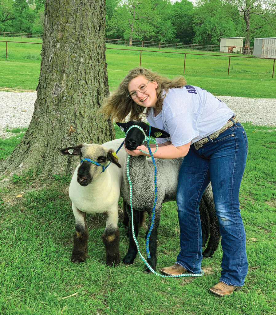 Caity Garrett of Oronogo, Missouri with her sheep. Photo by Rachel Harper.