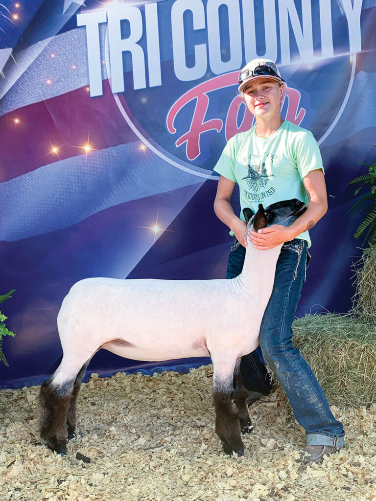 Sadie Schober from Mountain Grove, Missouri with her sheep at the Tri County Fair. Submitted Photo.