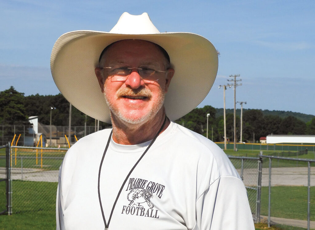 Danny Abshier of Prairie Grove, Arkansas is a P.E. teacher and football coach. He helps run his families 80-acre farm. Photo by Terry Ropp. 