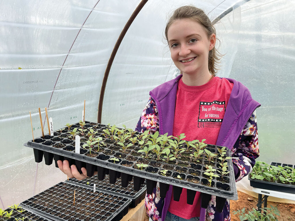 Karley Jones is only 14, but she has started her own business, growing and selling about 30 varieties of flowers and plants. Photo by Kacey Frederick.