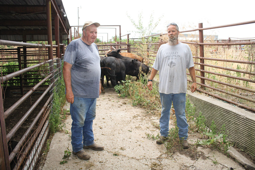 Dale Steinhoff, left, is the owner of El Dorado Springs Livestock Market, and the sale barn in Lockwood,Mo. HIs son-in-law Mark Maltsberger, right, works with Dale. Photo by Julie Turner-Crawford. 