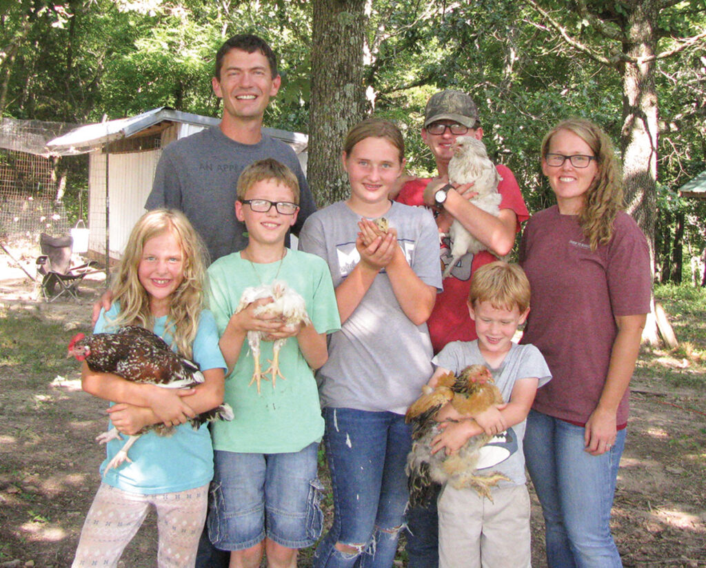 Eric and Michelle Nabinger, pictured with their children Ryan, Alyssa, Ethyn, Alayna and Jeremy, recently settled as Eric’s military career came to a close. The family plans to develop a farm-to-table enterprise. Photo by Brenda Brinkley.