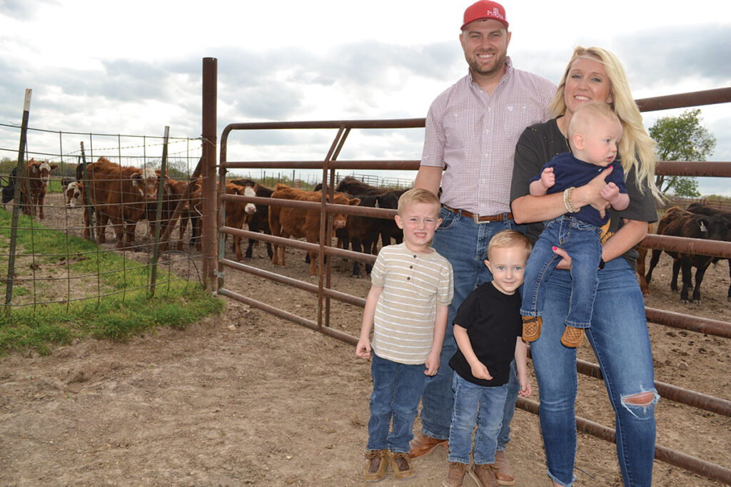 Josh Glendenning, pictured with his wife Kayla, and sons Easton, Hudson and Bode, raises cattle with his family near Lebanon, Mo. Photo by Laura L. Valenti. 