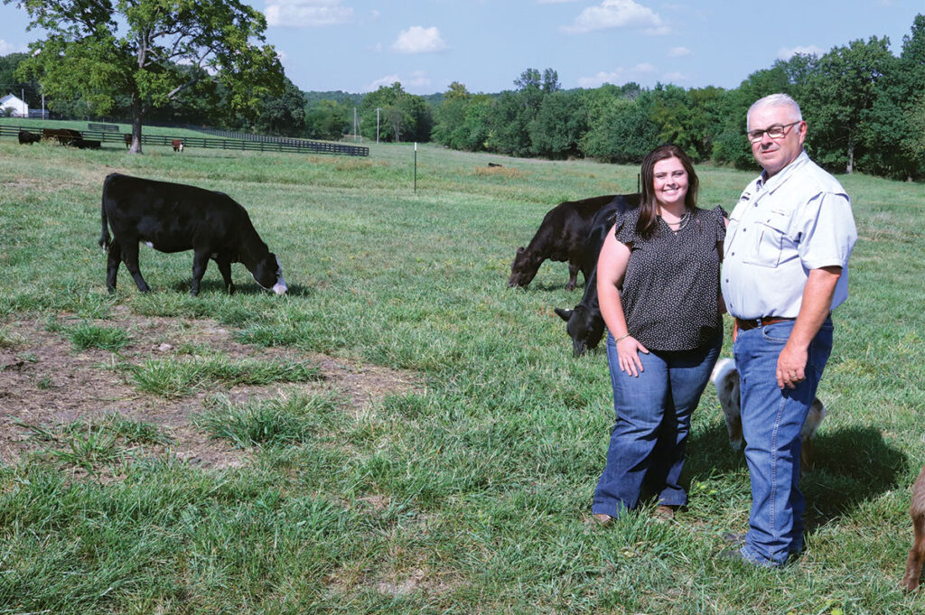 Grace Erickson and her father work together to breed high-quality 
Simmental cattle. Photo by Julie Turner-Crawford. 