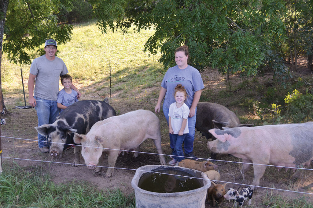The Watts family operate a farm in Camden County, Mo., where they raise pigs. Photo by Laura L. Valenti. 