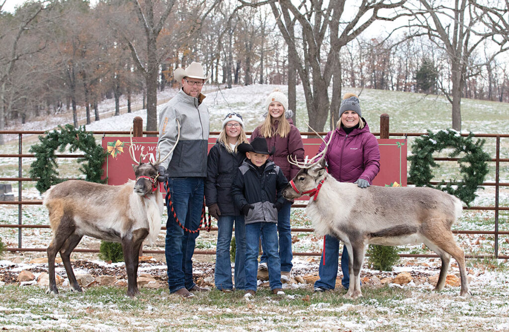 Micheal and Sara Prescott, along with their children Emma, Madison and Carter, raise cattle,  added reindeer to their cattle operation. Contributed Photo. 