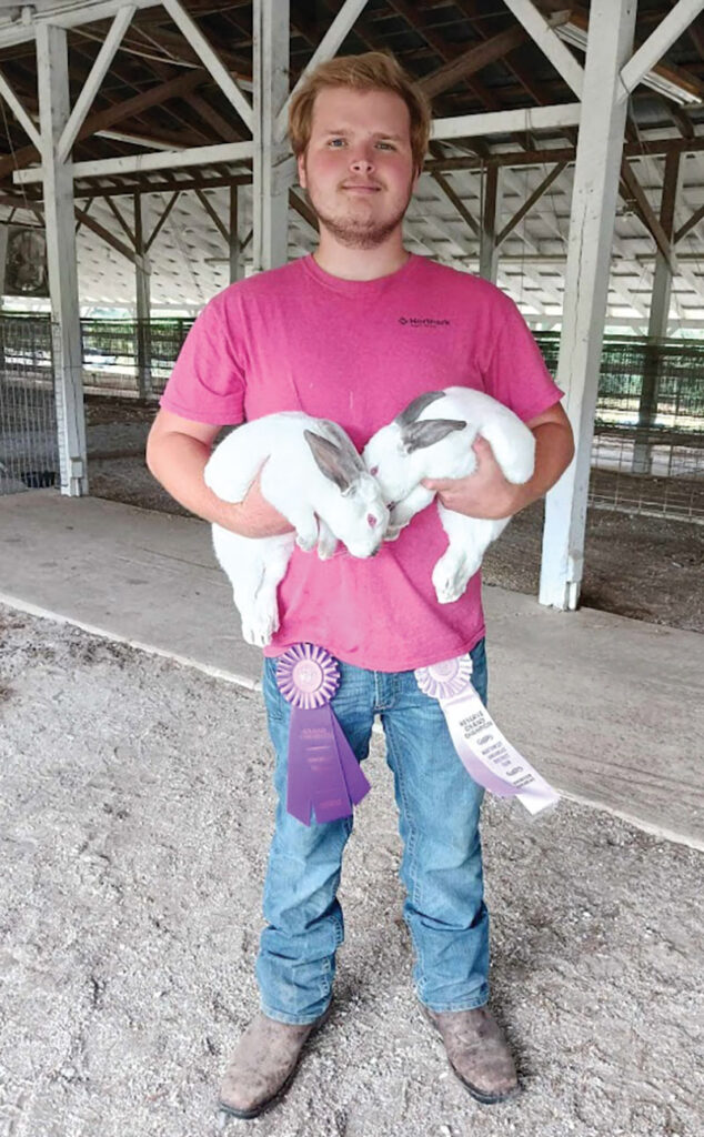 “I do it all myself,” Beau Smith said of his farming operation. The young farmer has heritage-breed chickens, purebred Wagyu, rabbits and “Ozark Mountain cattle.” Contributed Photo.