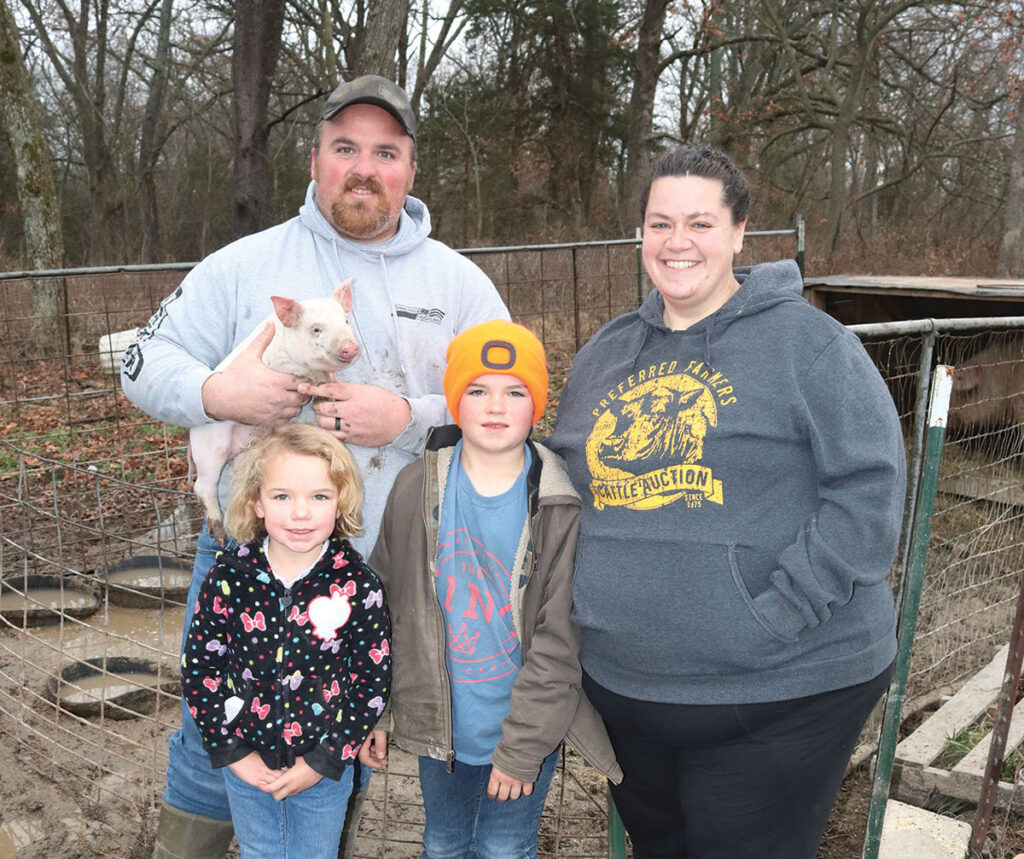 Joe and Kelli Hernandez, along with their children, Weston and McKenzie operate Freedom Farms near Conway, Mo. Photo by Julie Turner-Crawford. 